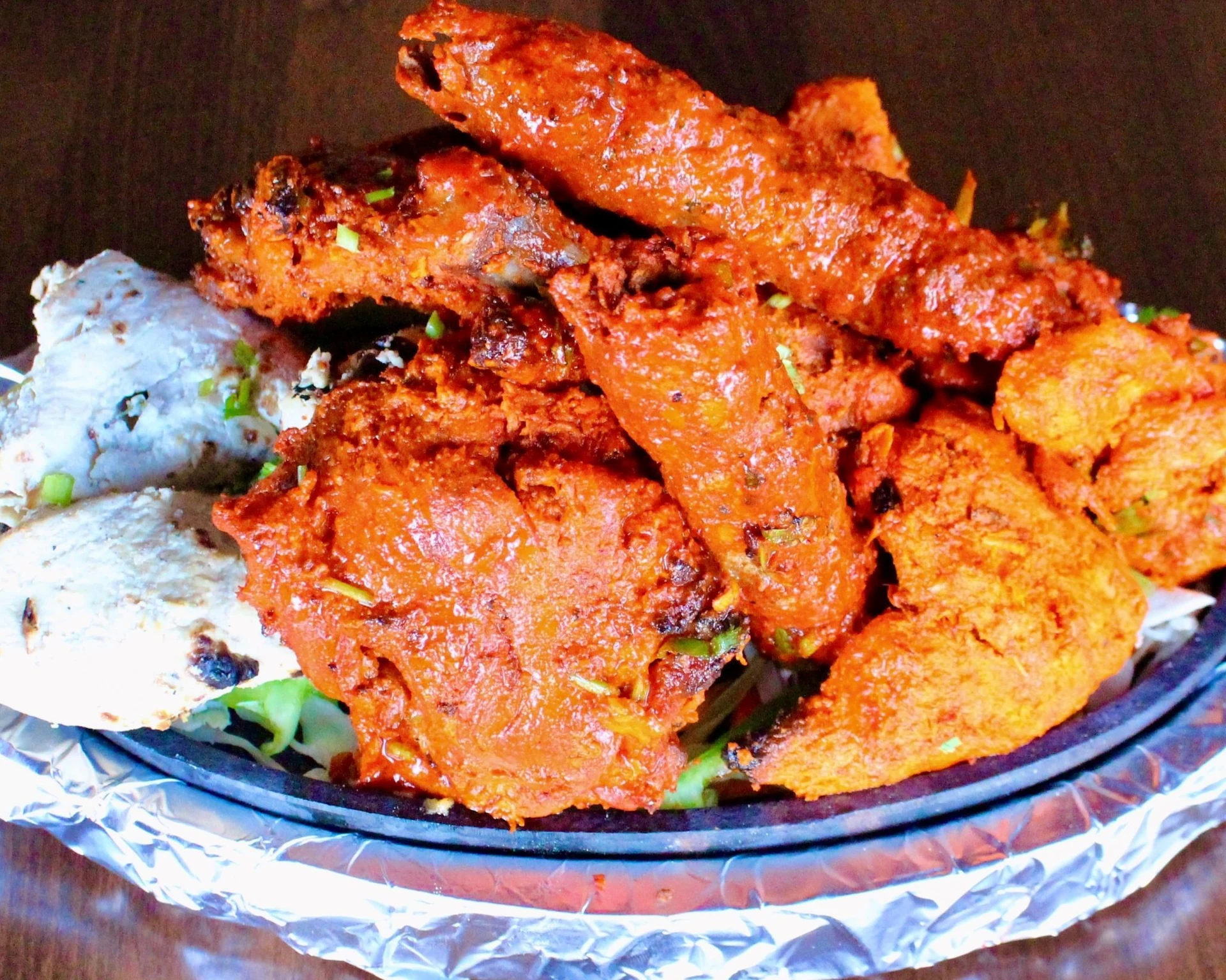 Popular Indian dishes for delivery in Calgary - butter chicken, tandoori chicken and naan