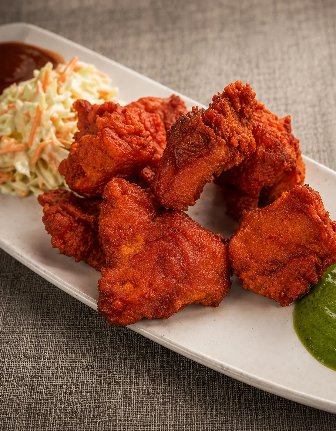 Crispy fish pakora appetizer with mint chutney at Tamarind East Indian Restaurant Calgary