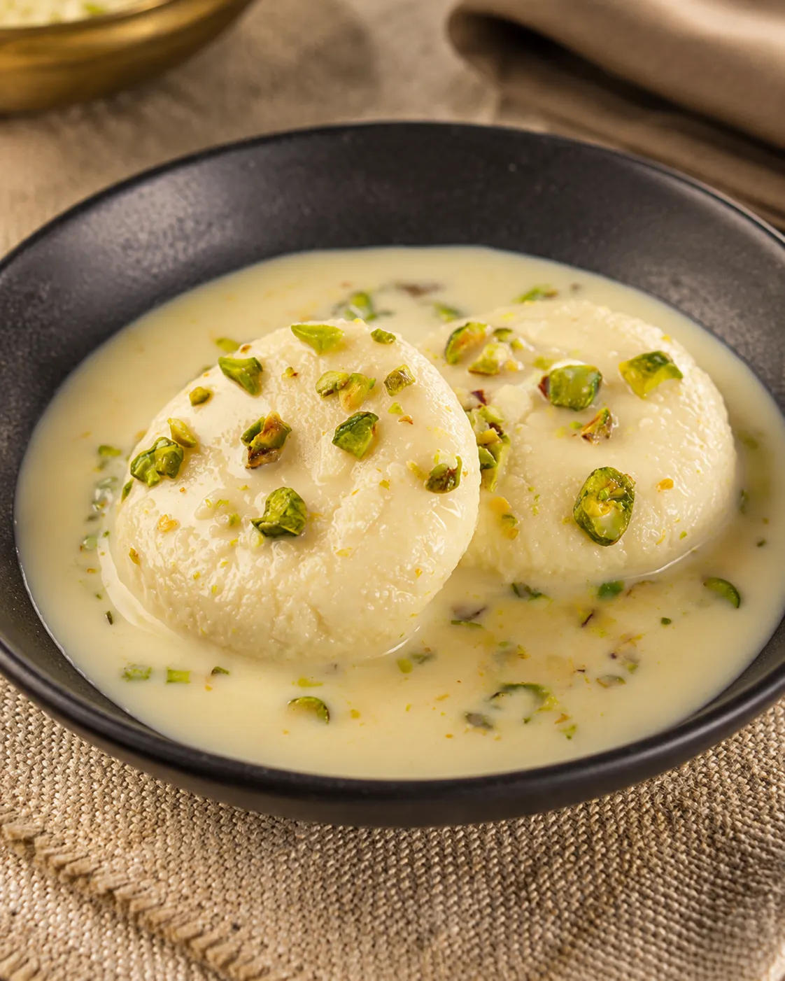 Rasmalai soaked in saffron cream and pistachio at Tamarind East Indian Restaurant Calgary